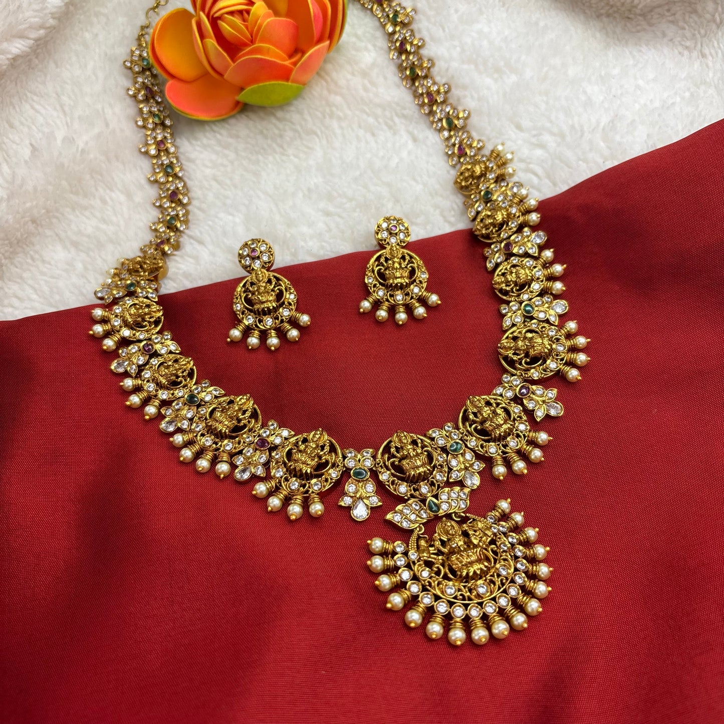 Beautiful temple design long haram sets with cubic zirconia stones