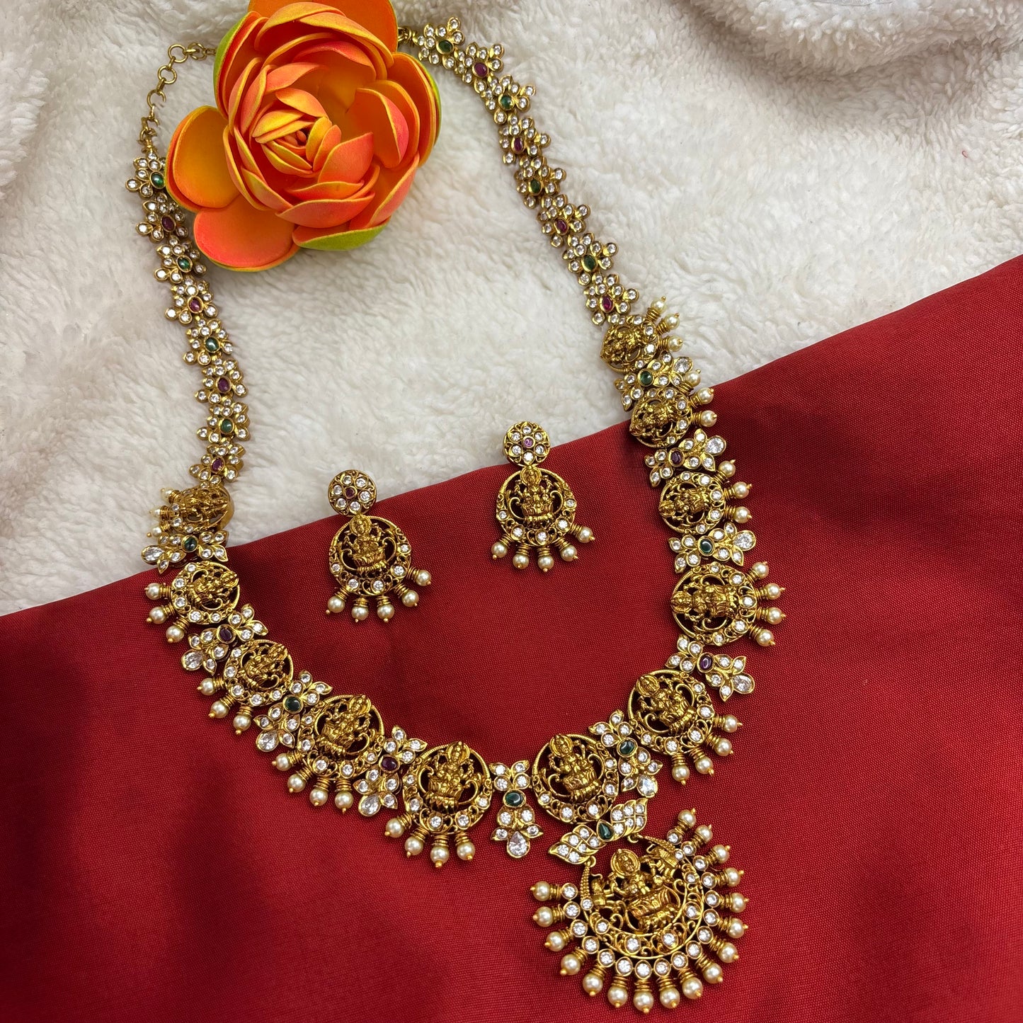 Beautiful temple design long haram sets with cubic zirconia stones