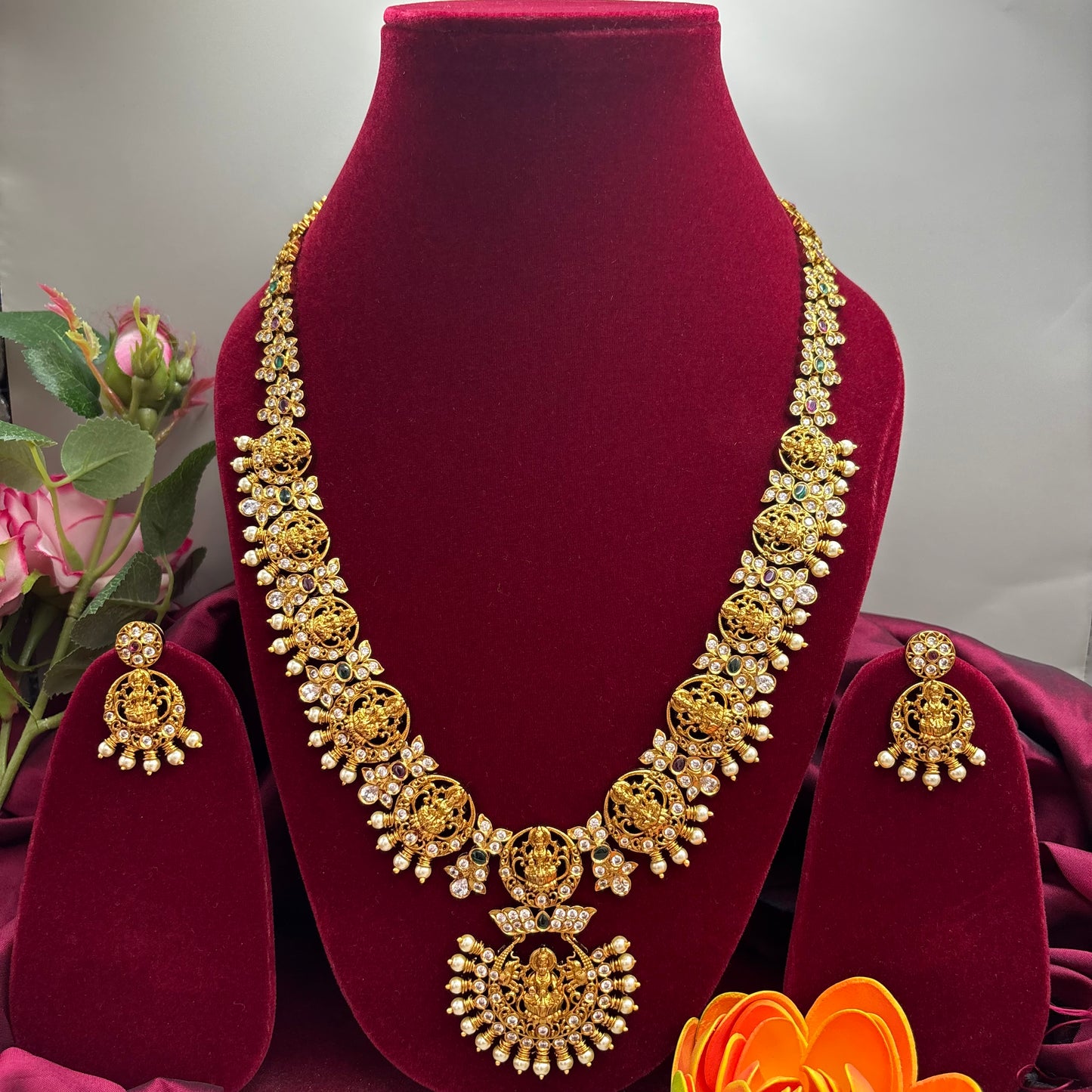 Beautiful temple design long haram sets with cubic zirconia stones