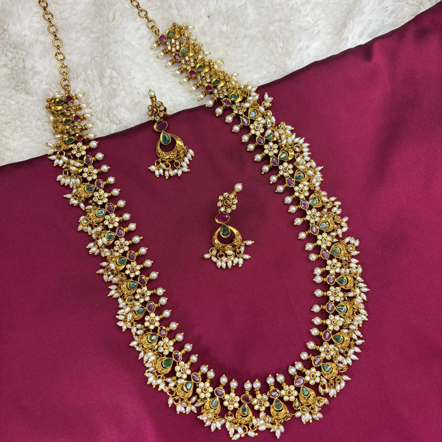 Regal Tradition – Guttapusalu Long Haram Set with Green & Pink Stones and Rice Pearl Clusters