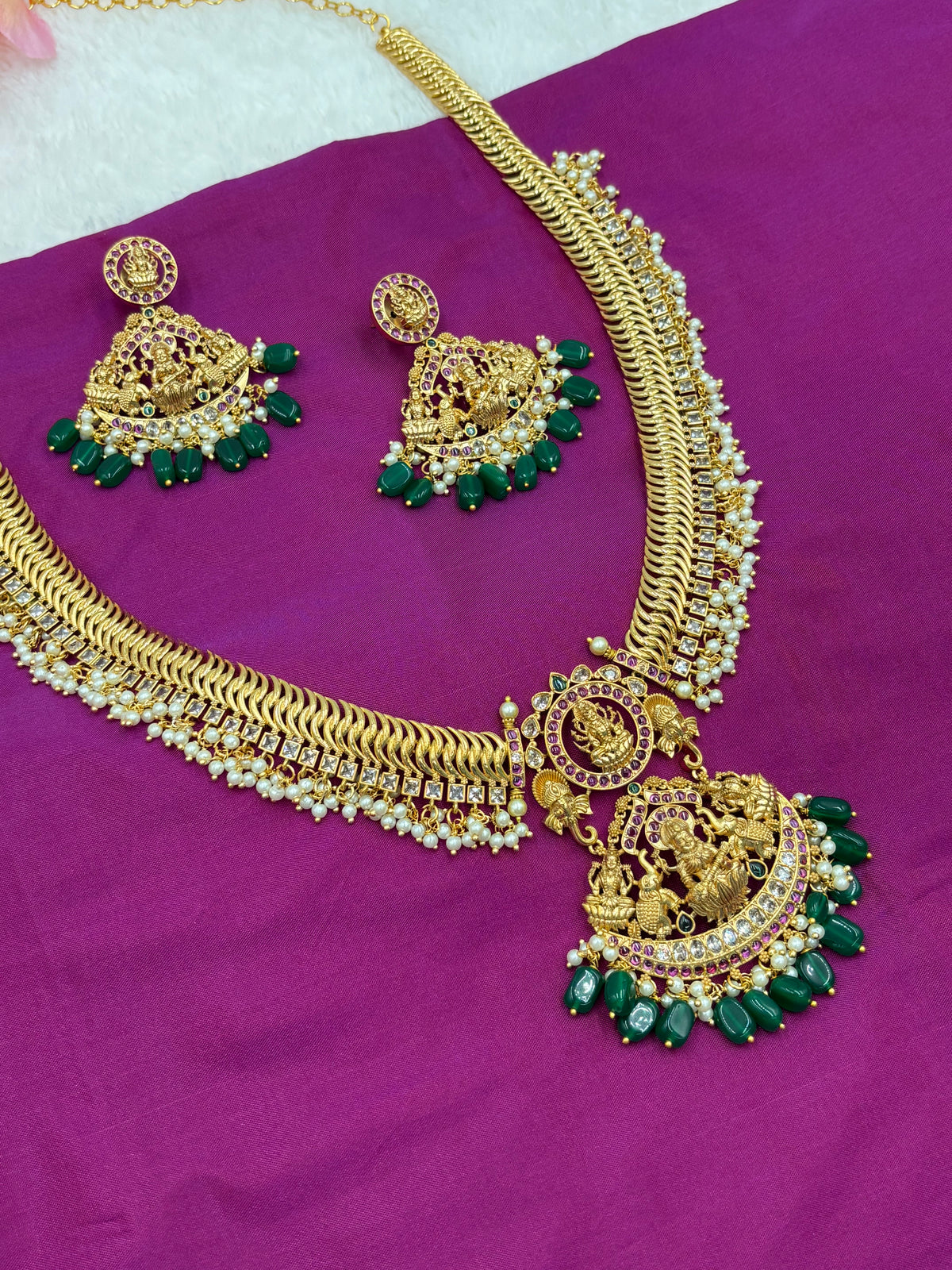 Premium Gold Finish Temple Long Haram Set with Green Stone Detailing & Matching Earrings