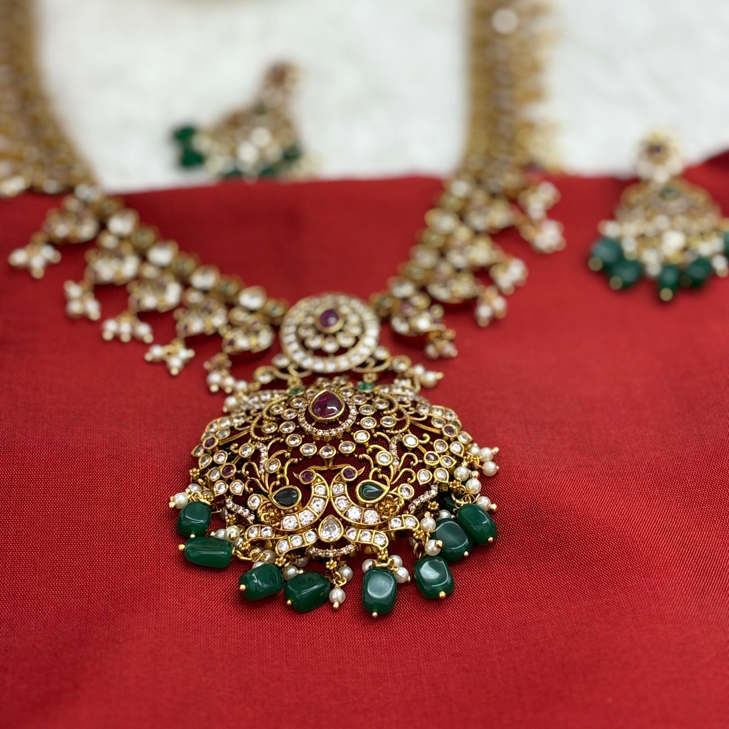 Premium quality matte gold finish long haram sets with green beads