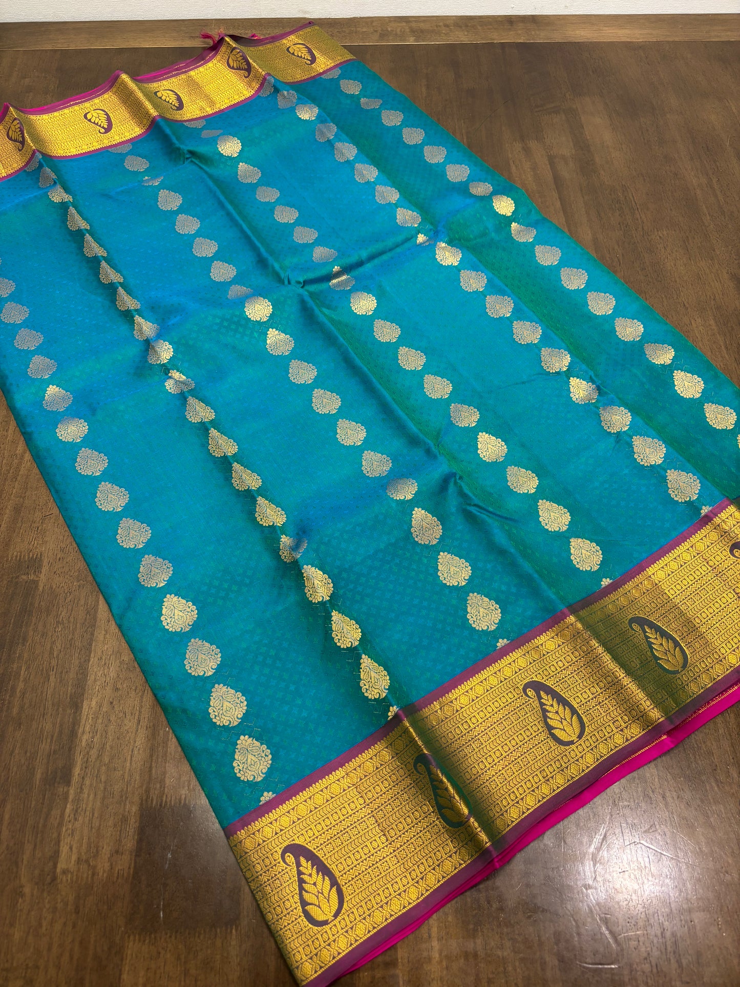 Peacock Green & Rani Pink Pure Kanchipuram Silk Saree with Zari Border