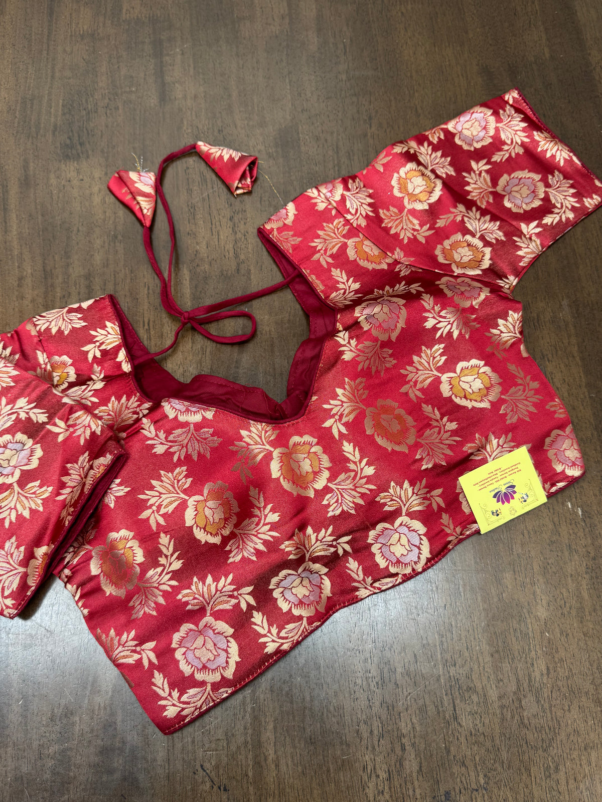 Deep maroon paired with gold‑woven florals creates a timeless blouse perfect for weddings, temple visits, and cultural celebrations.