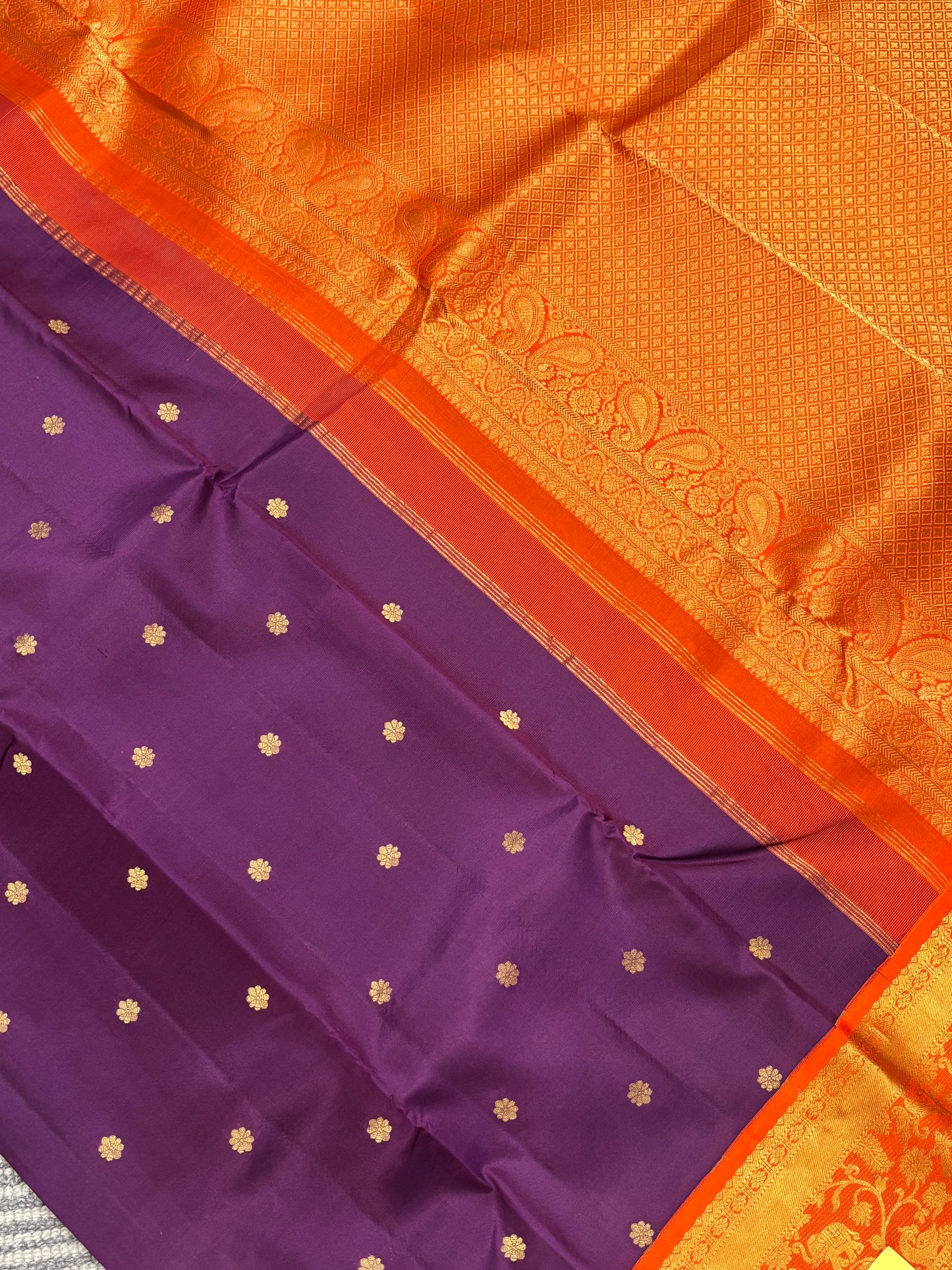 Elegant Purple Kanchipuram Silk Saree Featuring Orange Contrast and Floral Buttas