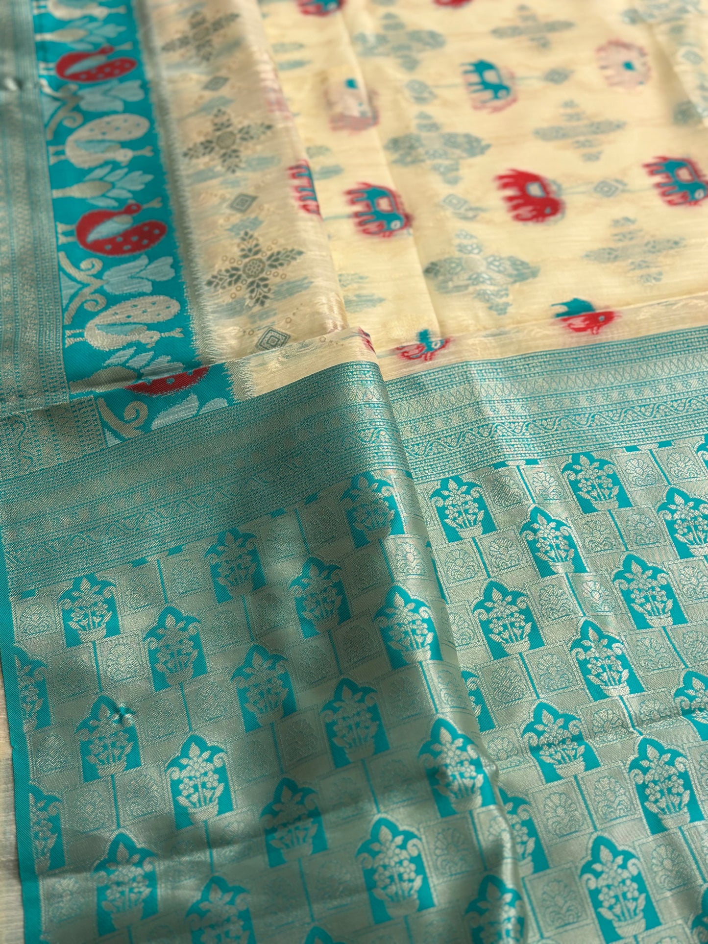 Elegant Silk‑Cotton Jamdani Saree – Cream Body with Elephant Prints and Sky‑Blue Contrast