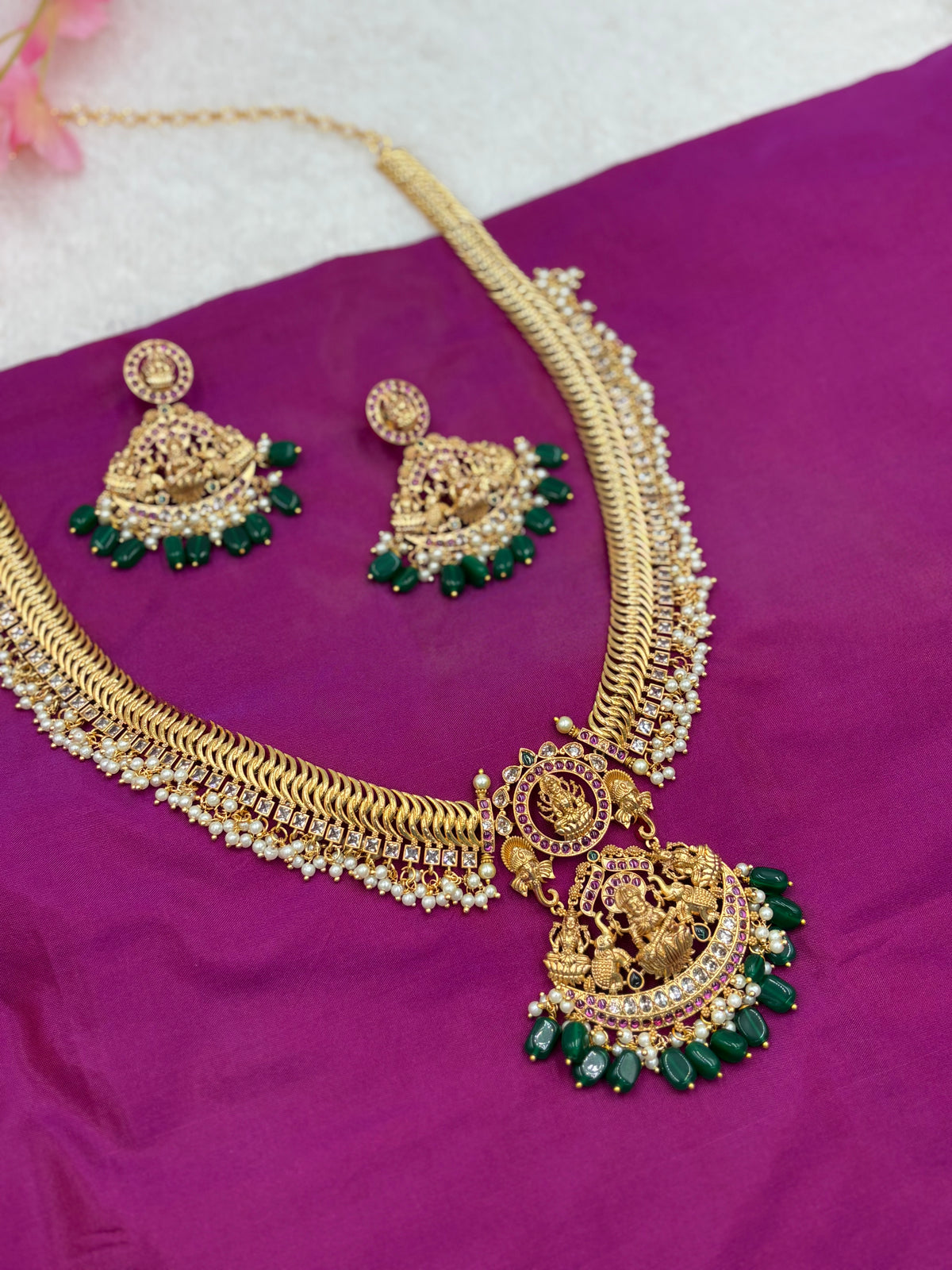 Premium Gold Finish Temple Long Haram Set with Green Stone Detailing & Matching Earrings