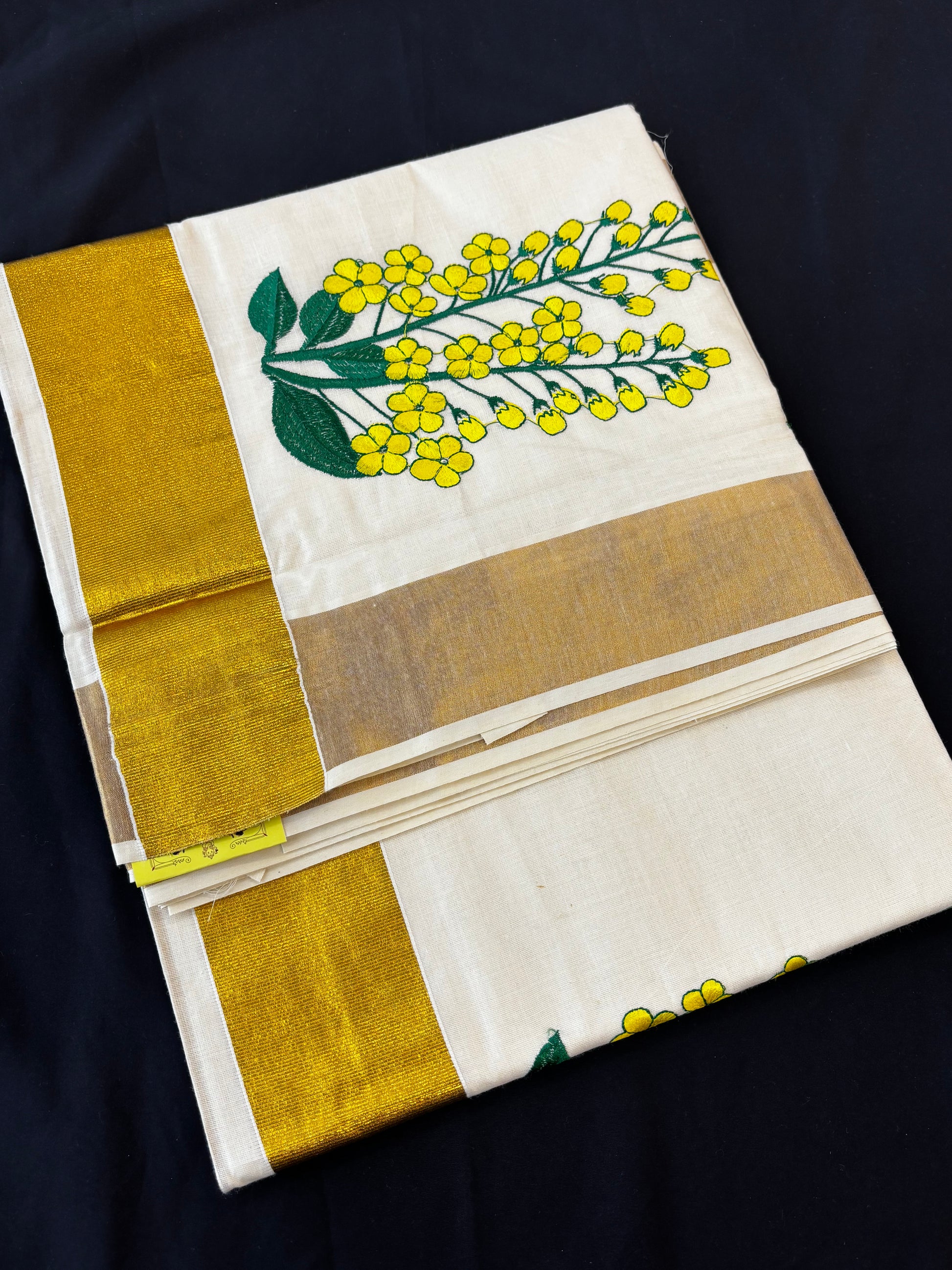 Kerala Kasavu saree with yellow floral embroidery and gold border – view 2