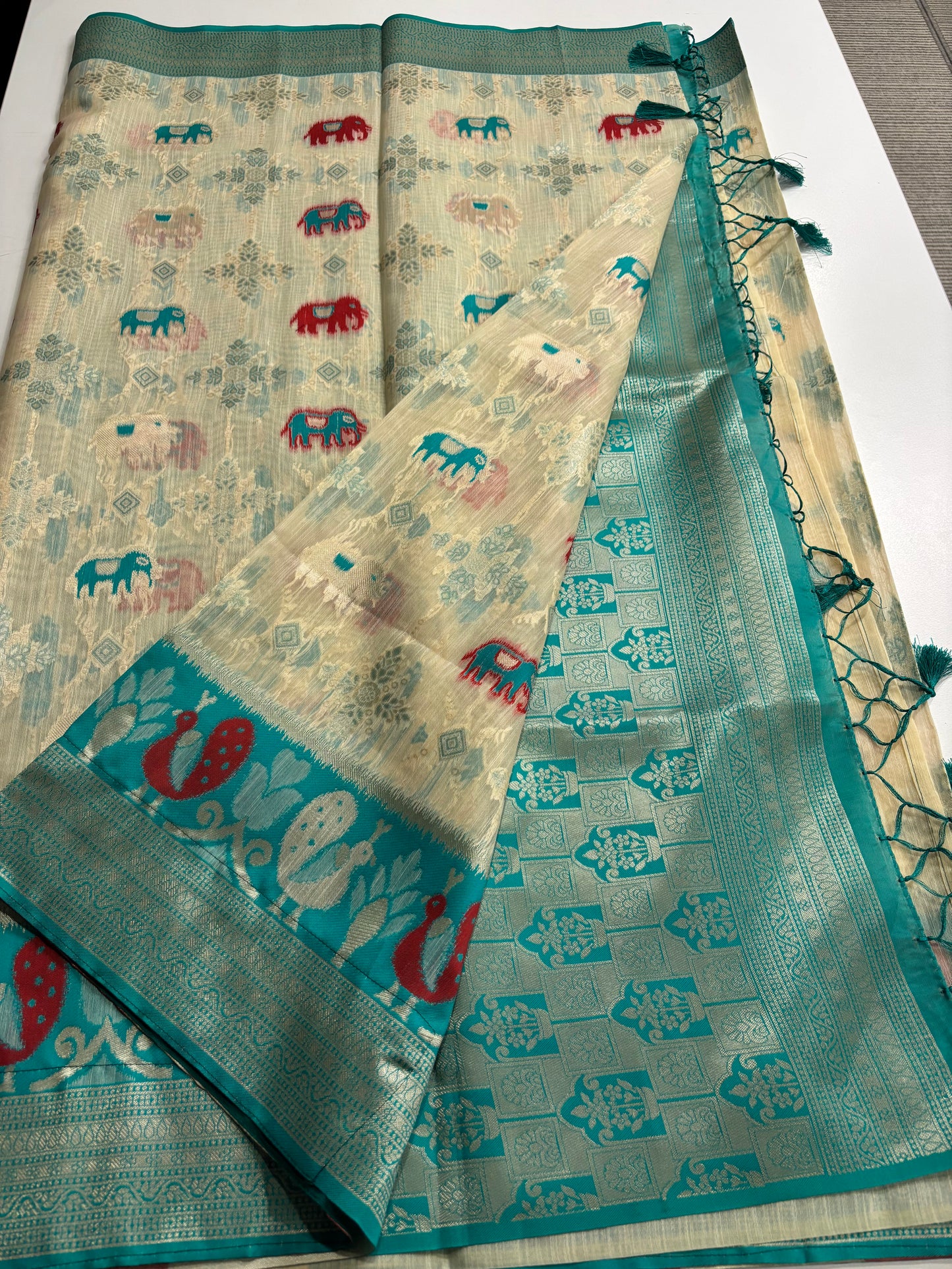 Elegant Silk‑Cotton Jamdani Saree – Cream Body with Elephant Prints and Sky‑Blue Contrast