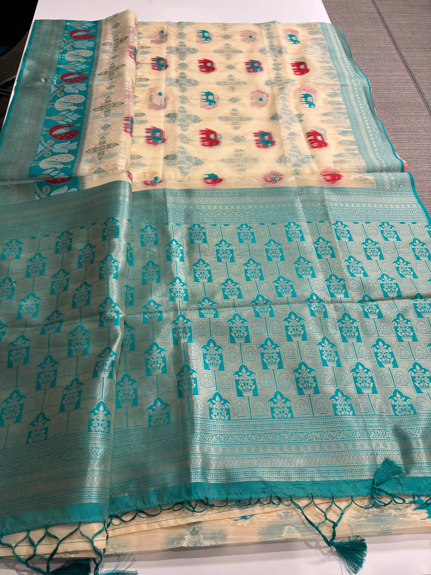 Elegant Silk‑Cotton Jamdani Saree – Cream Body with Elephant Prints and Sky‑Blue Contrast