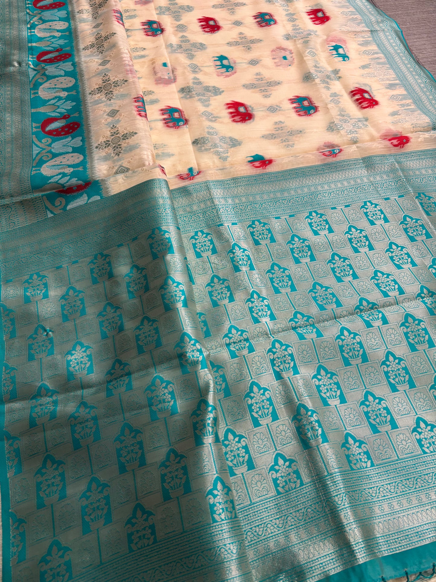 Elegant Silk‑Cotton Jamdani Saree – Cream Body with Elephant Prints and Sky‑Blue Contrast