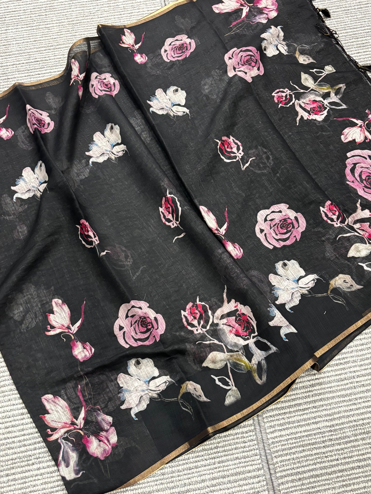Beautifully Crafted Black Linen Cotton Saree with Floral Print, Golden Border, Tassels & Printed Blouse Piece | Shrees Fashion