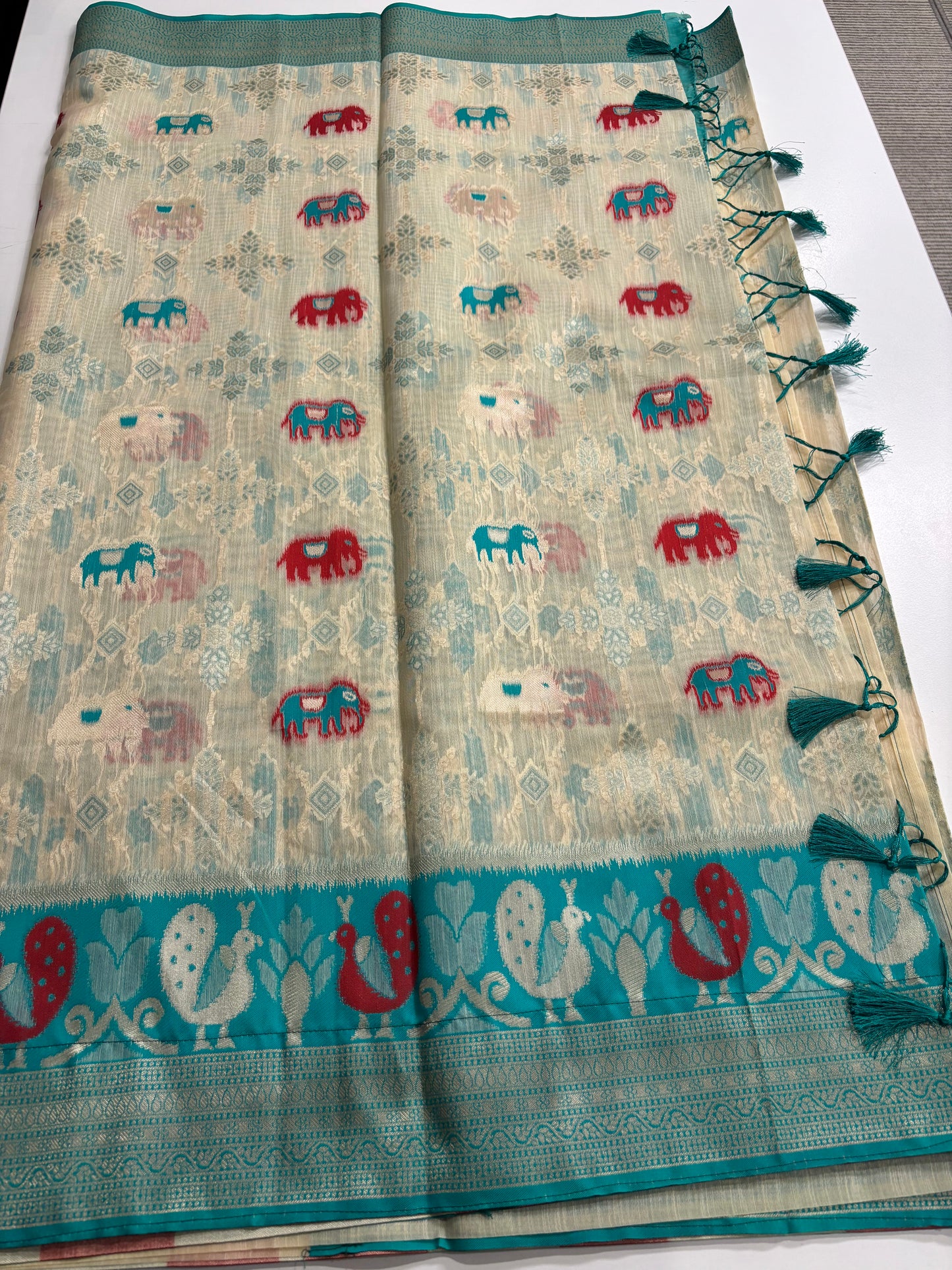 Elegant Silk‑Cotton Jamdani Saree – Cream Body with Elephant Prints and Sky‑Blue Contrast