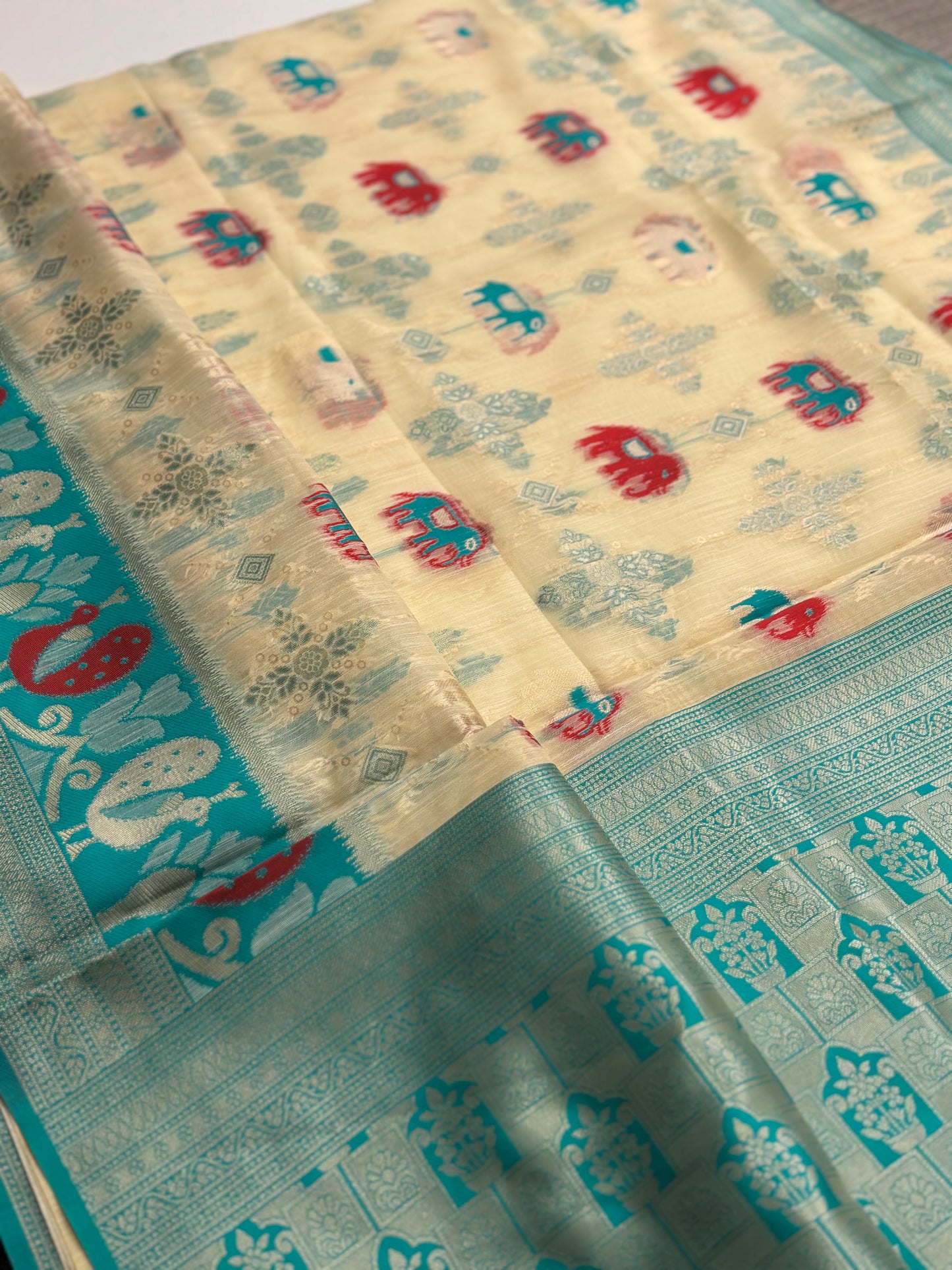 Elegant Silk‑Cotton Jamdani Saree – Cream Body with Elephant Prints and Sky‑Blue Contrast