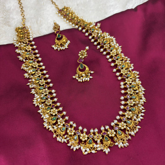 Regal Tradition – Guttapusalu Long Haram Set with Green & Pink Stones and Rice Pearl Clusters