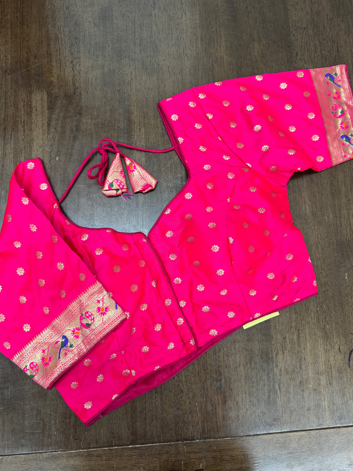 Elegant Pink Blouse Featuring Gold Motifs & Paithani Sleeve Design
