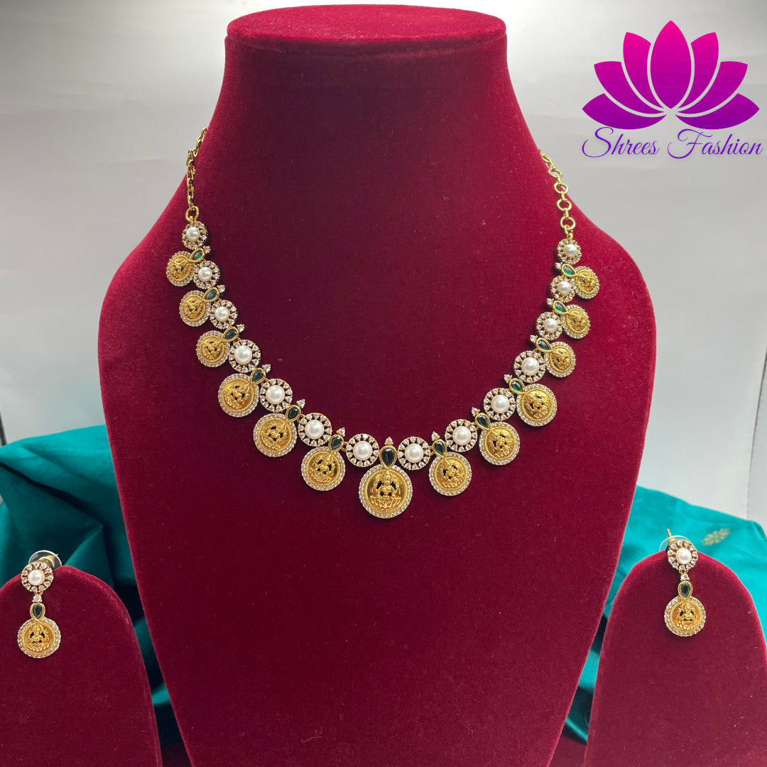 Elegant Matte Gold Mahalakshmi Coin Necklace with Green & White Stones and Pearls