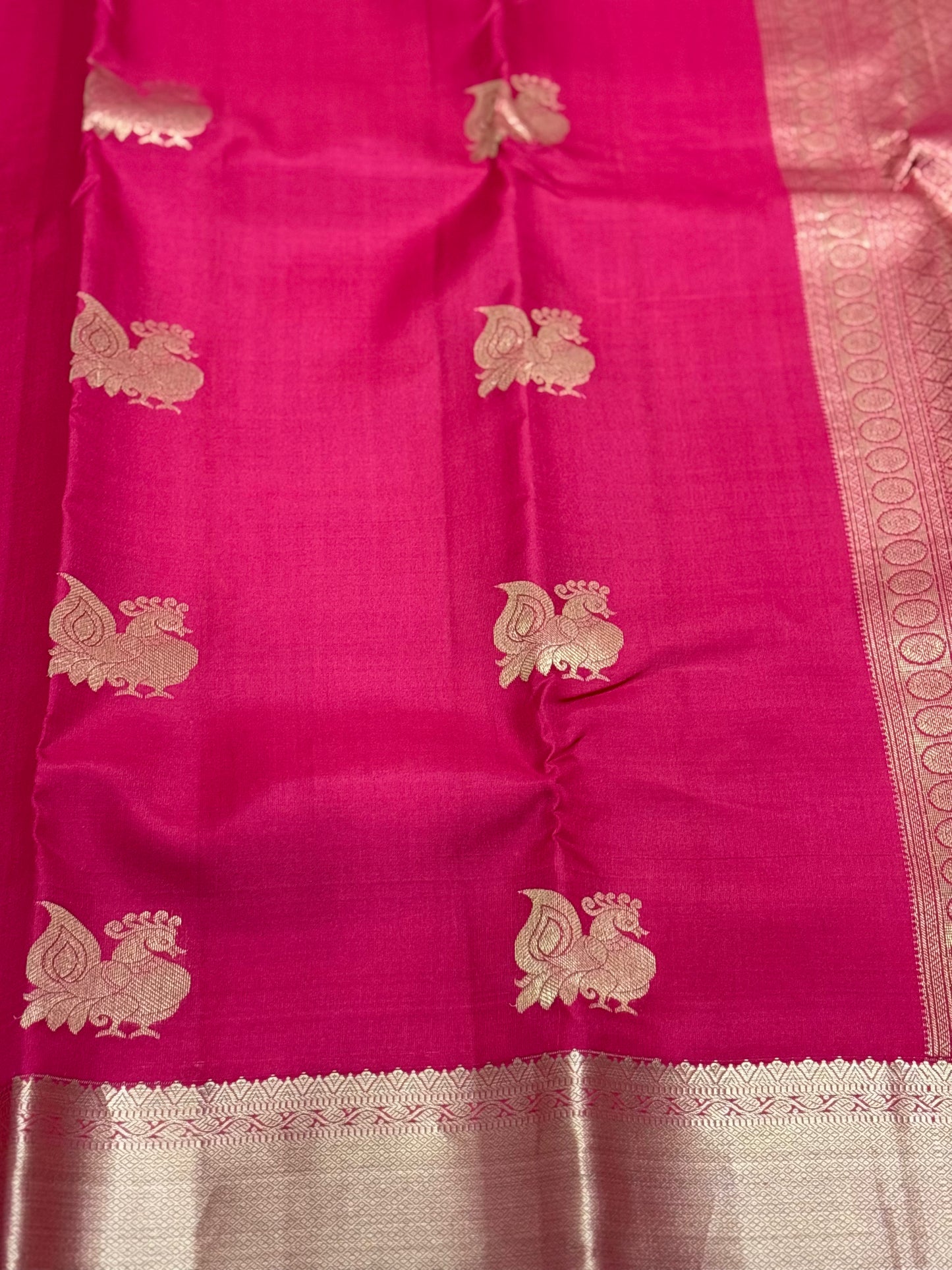 Raspberry Pink Kanchipuram Silk Saree with Gold Zari Peacock Buttas