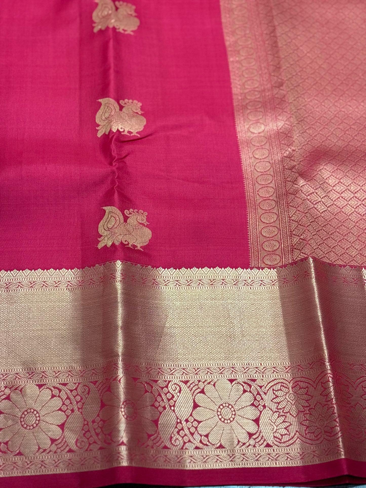Raspberry Pink Kanchipuram Silk Saree with Gold Zari Peacock Buttas